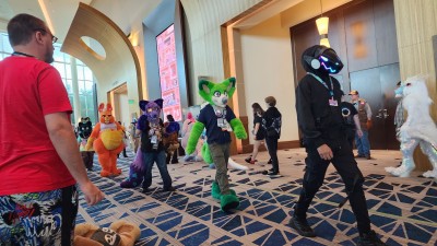 Photo of the Day 2 fursuit parade at Megaplex 2025.