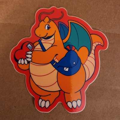 A Dragonite sticker purchased at the Megaplex 2025 Dealer's Den. Artist unknown (help appreciated).